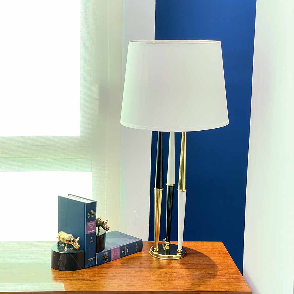 Helios Table Lamp – Creo Living Elevate your home décor with the Helios Table Lamp, a cylindrical black and white metal pillar with a round brass base, a modern and stylish bedroom lamp.Helios Table Lamp, cheap bedroom lamps, buy desk lamp, Table Lamps, table lamp price in Pakistan, lamps in Pakistan